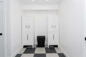 White shaker-style cabinetry with minimalist hardware