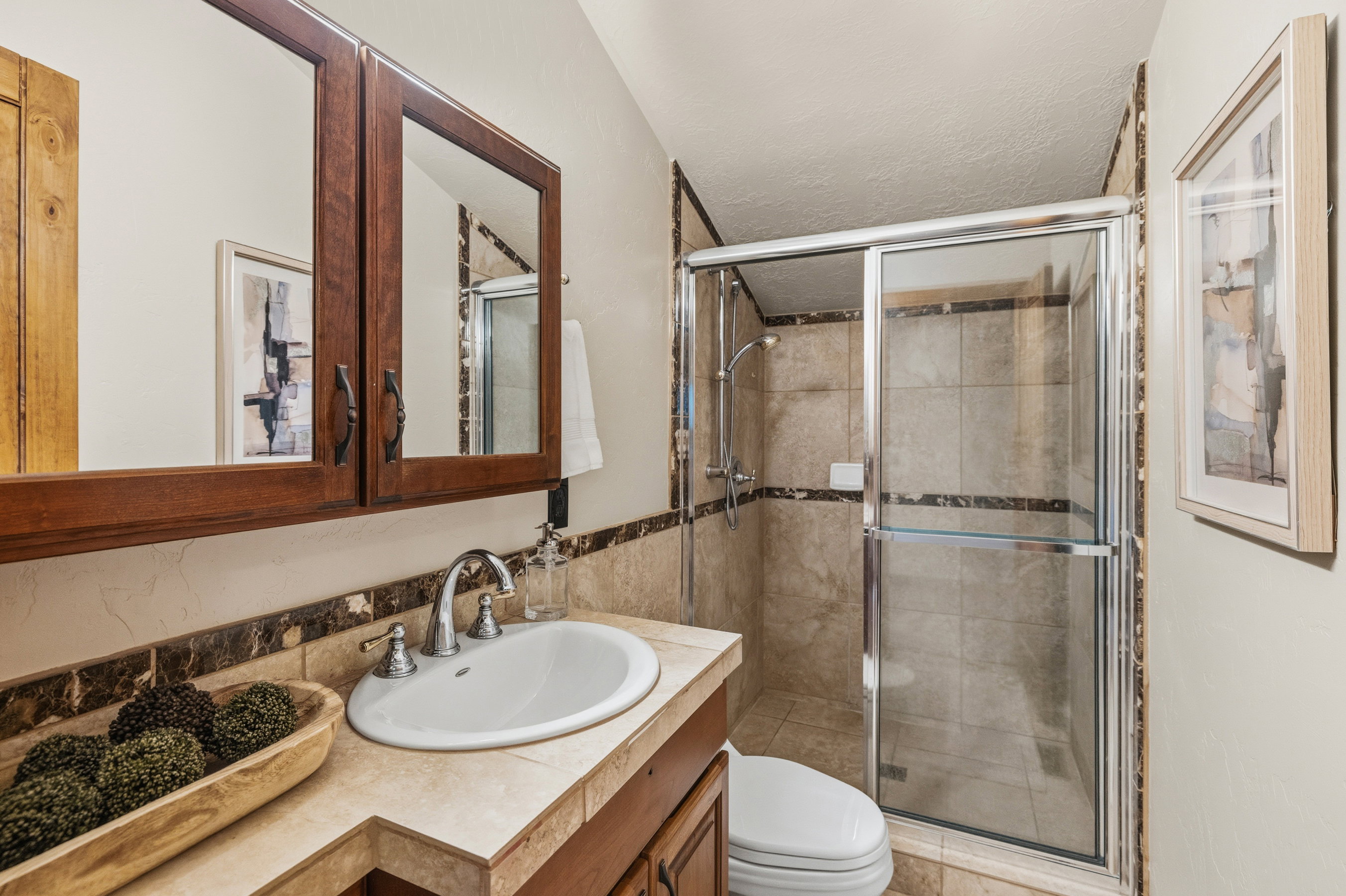 Bathroom vanity with an integrated sink and chrome faucet