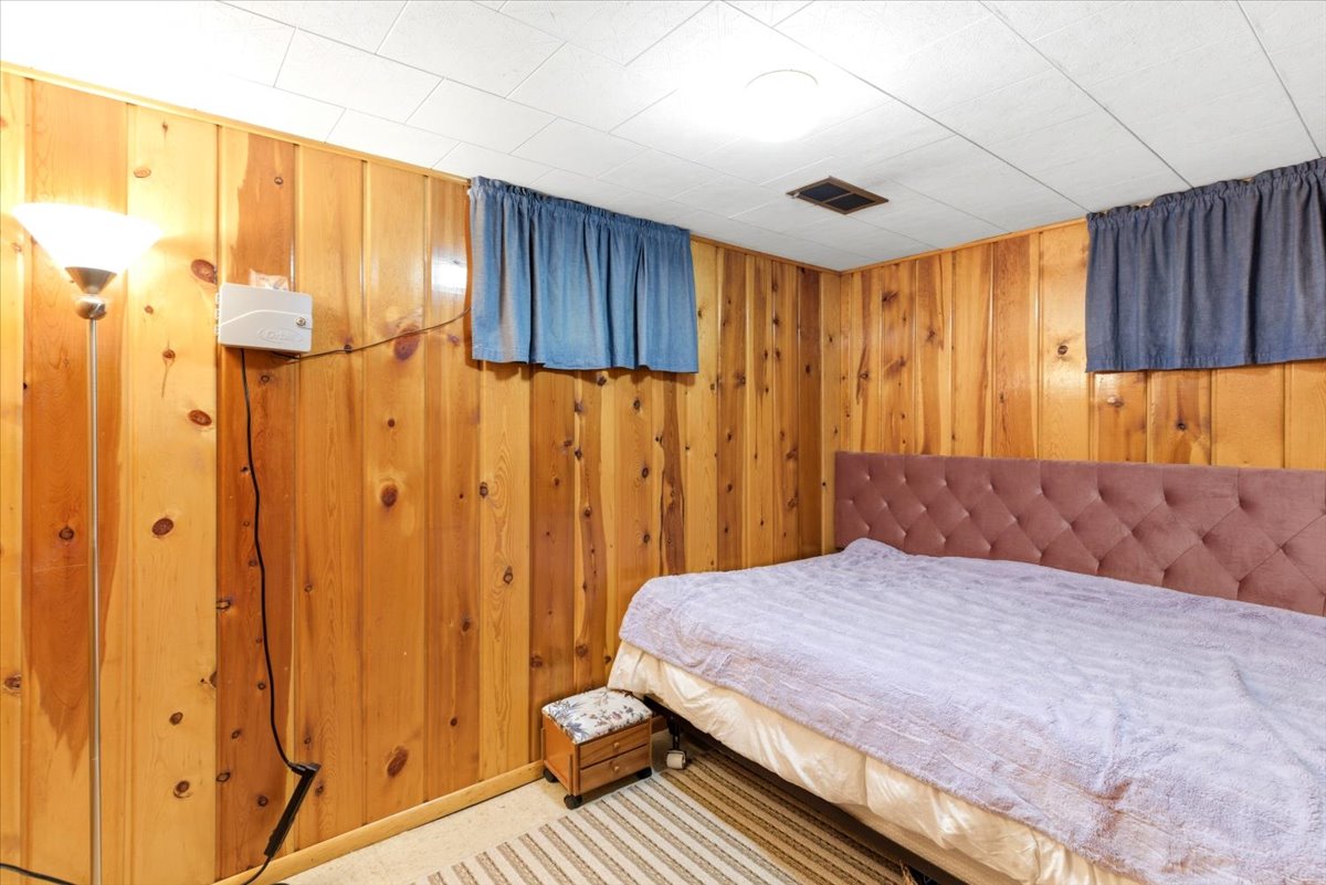 Wood-paneled wall surfaces with a built-in light fixture