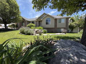 Brick and stucco exterior with multiple window styles
