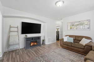 Living area featuring wood-finish flooring and light gray walls