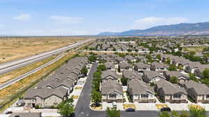Expansive neighborhood setting featuring numerous single-family homes with gray roofs