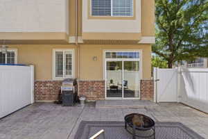 Stamped concrete patio featuring a fire pit