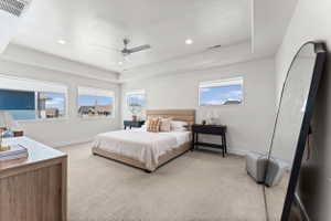 Spacious room featuring multiple windows, recessed lighting, and a ceiling fan