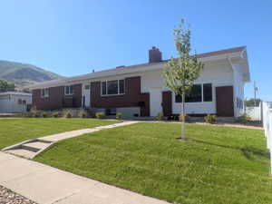 Brick and white siding exterior with a pitched roof