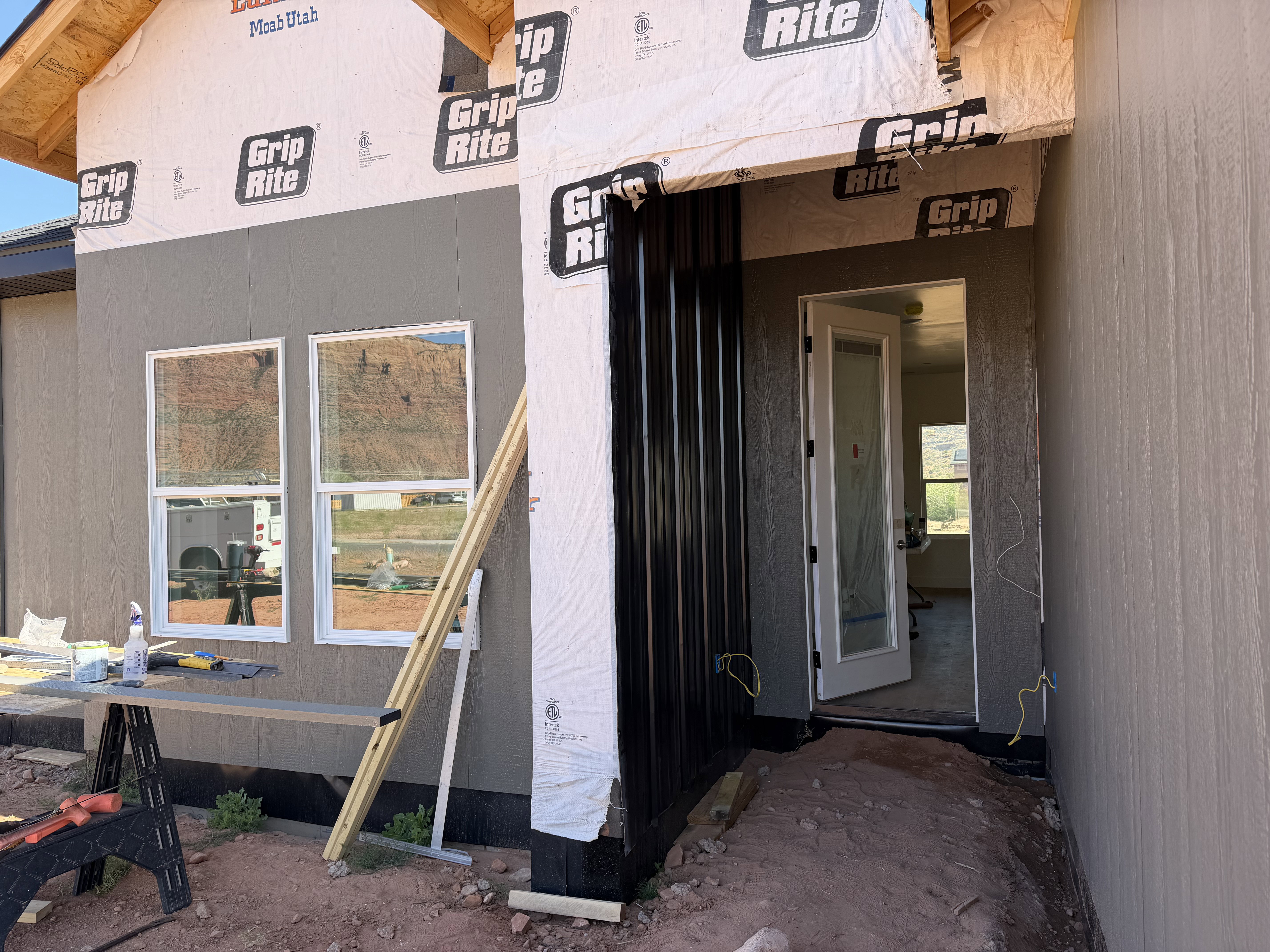 Entryway will feature black standing seam metal.
