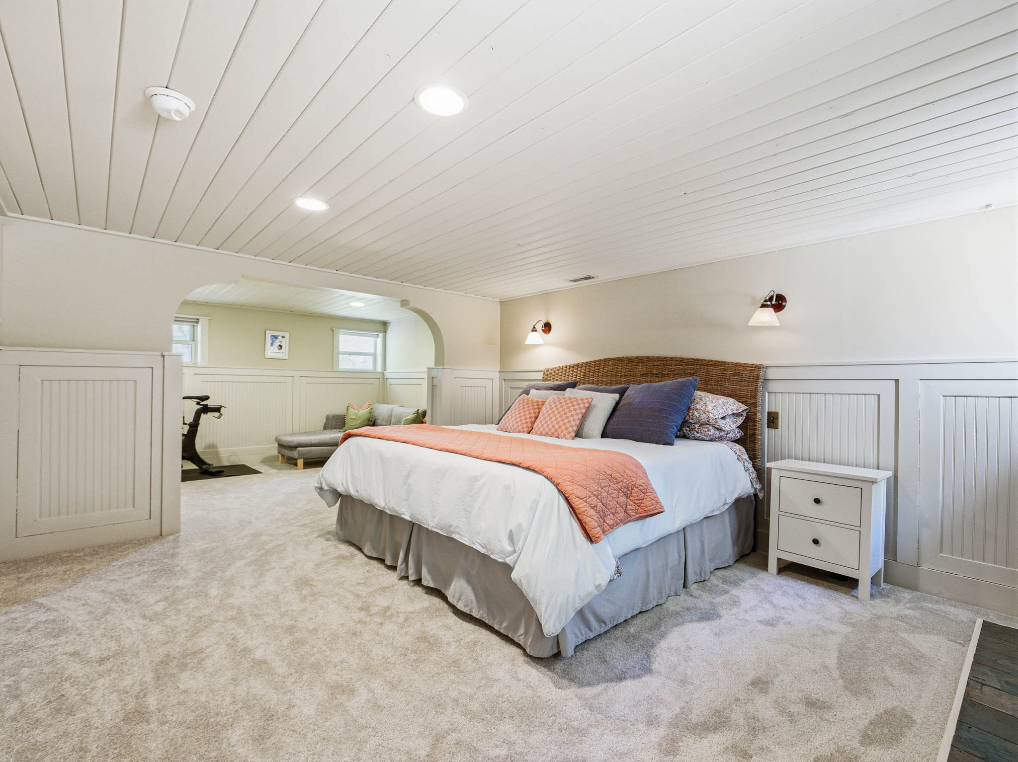 Carpeted room featuring a white paneled ceiling with recessed lighting
