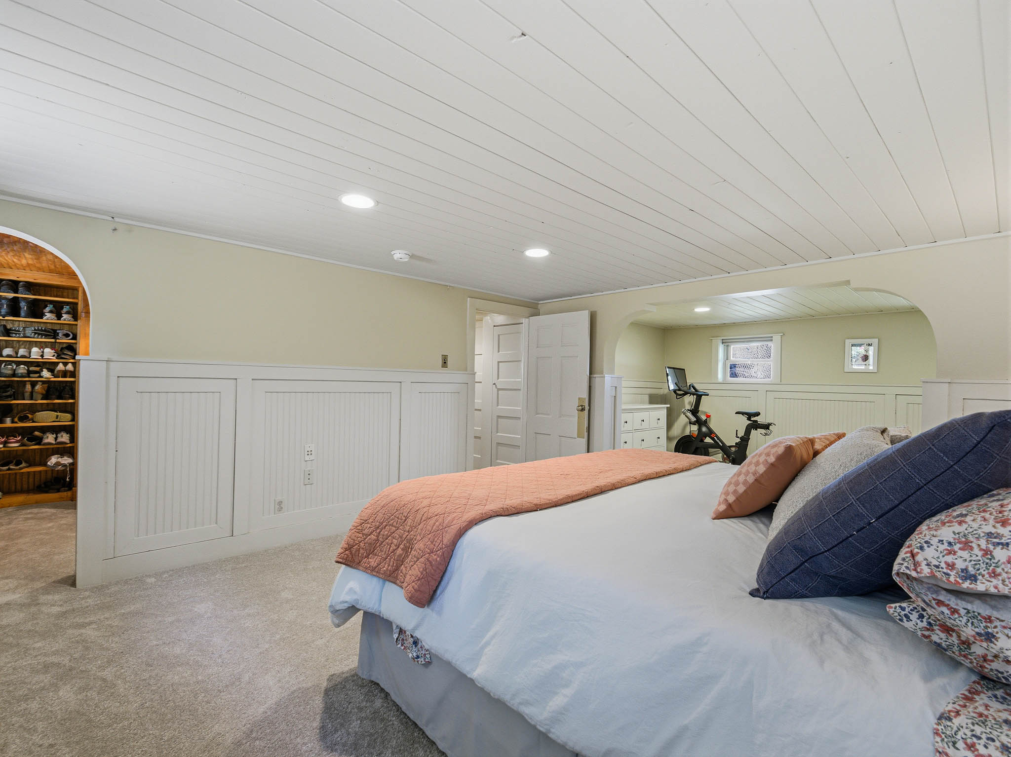 Carpeted bedroom with a beadboard accent wall, recessed lighting, and a white plank ceiling