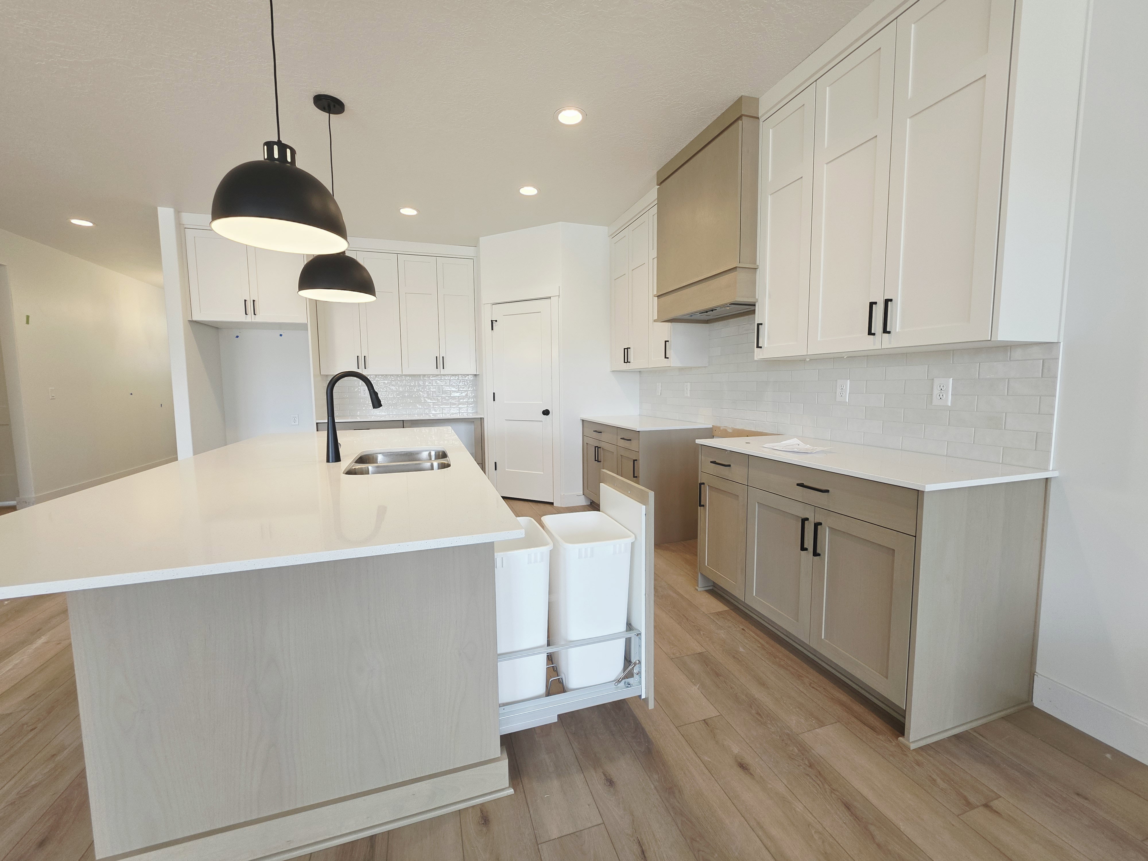 Kitchen featuring light wood-finish flooring and recessed lighting