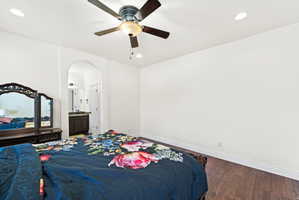 Bedroom featuring wood-finish flooring, recessed lighting, and a ceiling fan