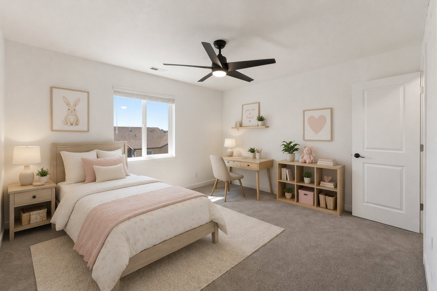 Carpeted room featuring a ceiling fan, a window with blinds, a white paneled door with a black handle, a light wood-finish nightstand, and a light wood-finish desk with a matching shelf