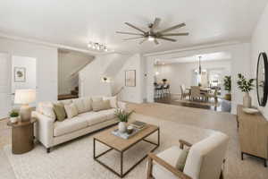 Spacious living area featuring light carpeting, a contemporary ceiling fan, and recessed lighting
