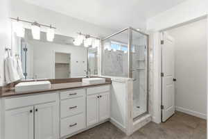 Modern bathroom featuring a dual vanity with rectangular vessel sinks and brushed nickel fixtures