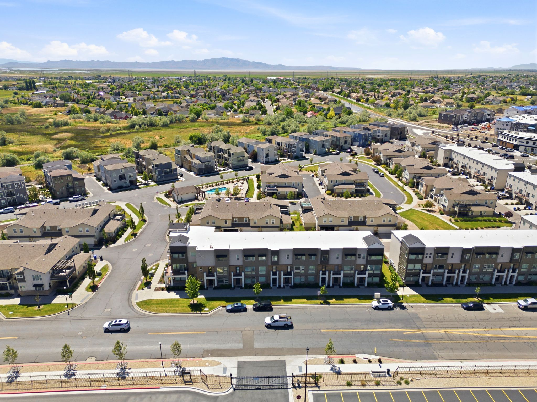 Expansive aerial capturing a contemporary residential development with varied architectural styles