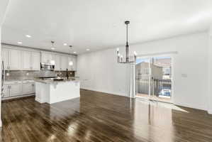 Open-concept living space with wood-finish flooring