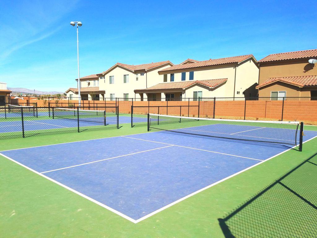 Sport court featuring blue and green surfacing