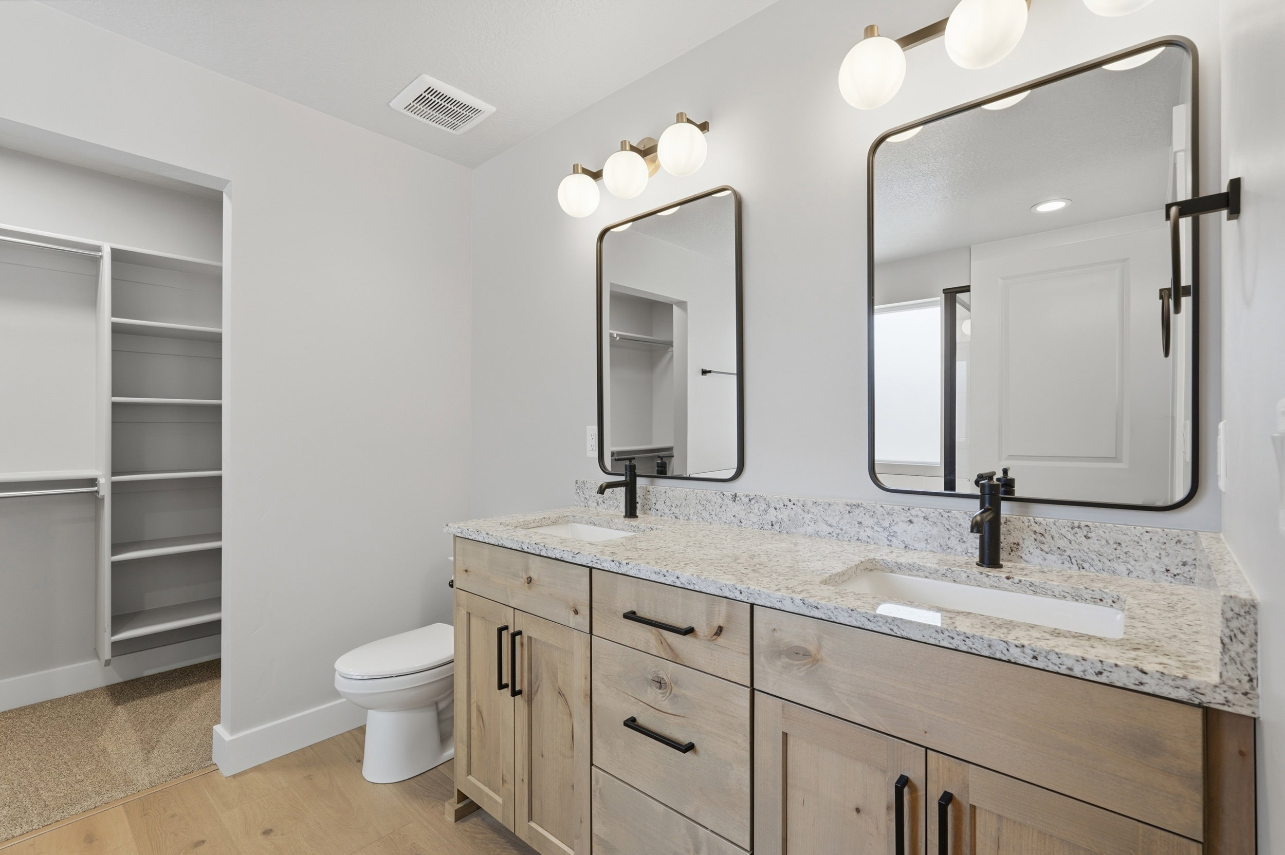 Primary bedroom ensuite bathroom with double vanity