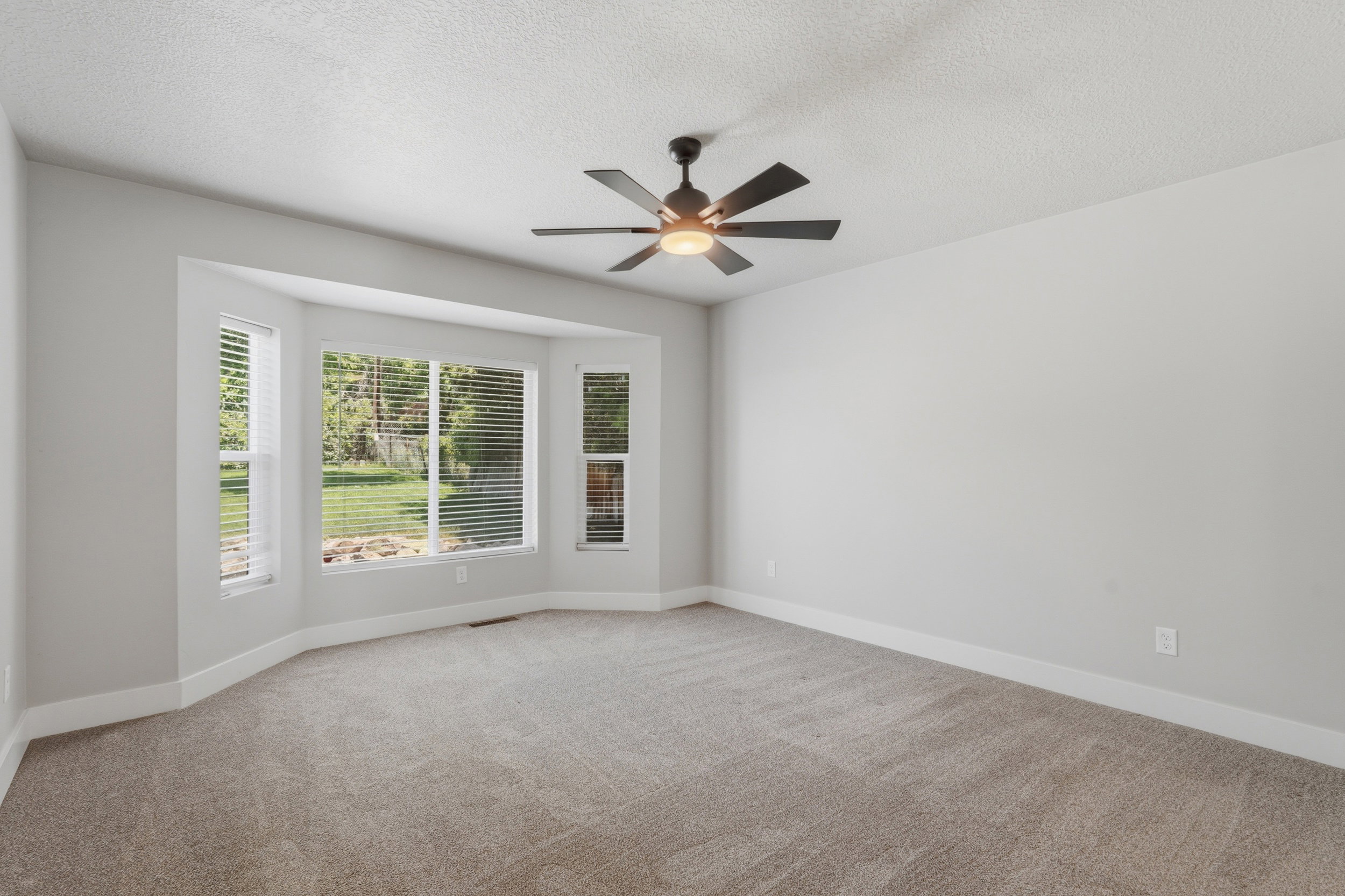 Primary Bedroom featuring a bay window.
