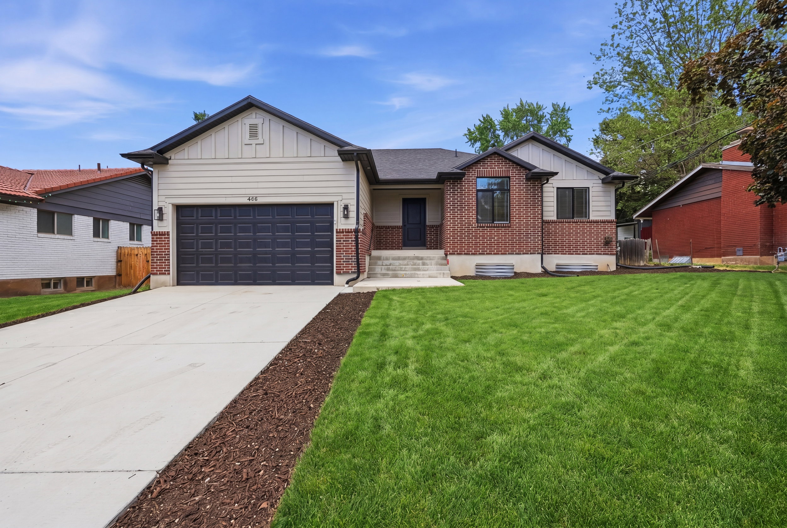 Modern facade featuring horizontal siding and brick accents