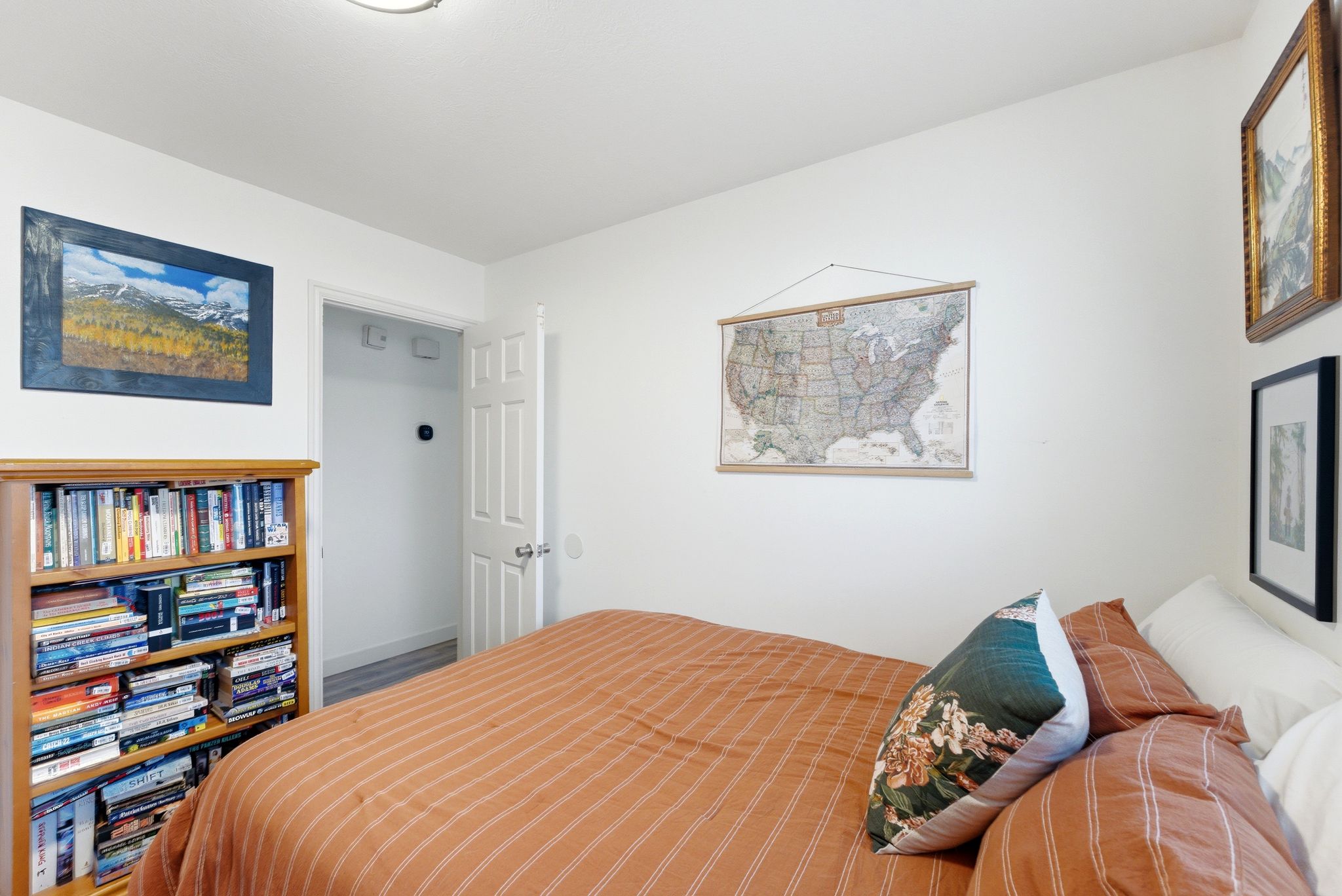 Room with light-colored walls and wood-finish flooring