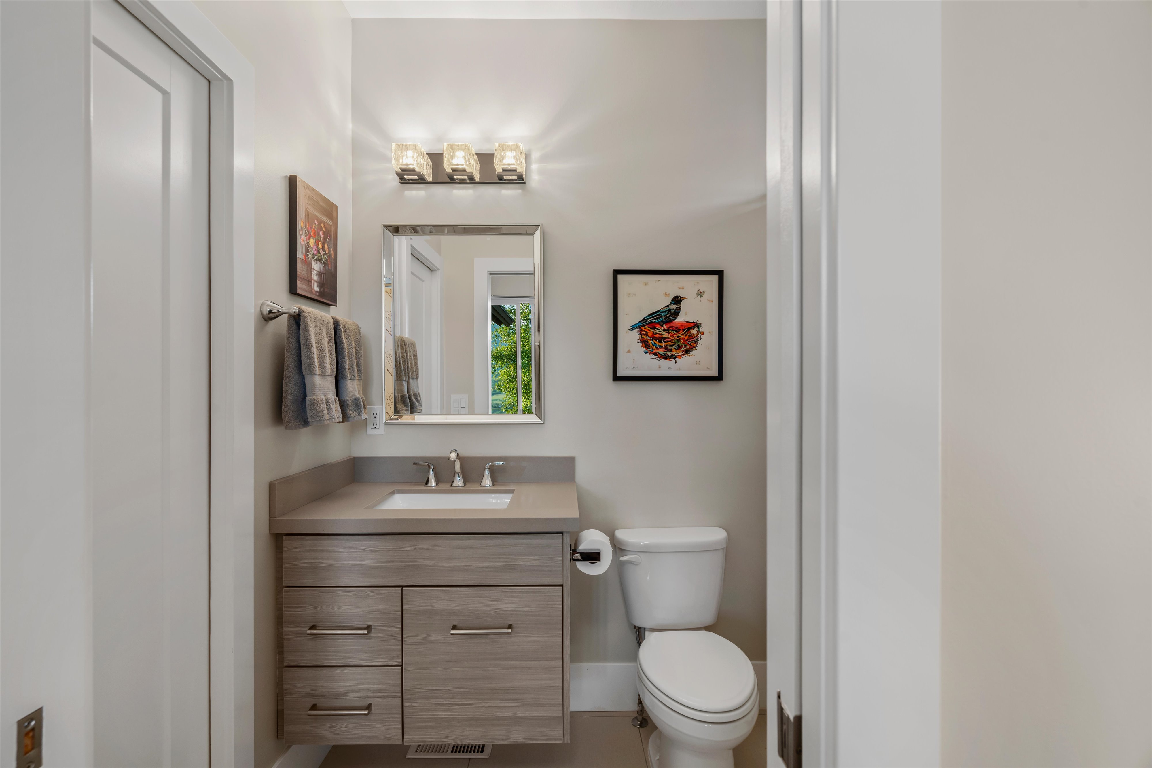 Contemporary vanity with stone-finish countertop and integrated sink