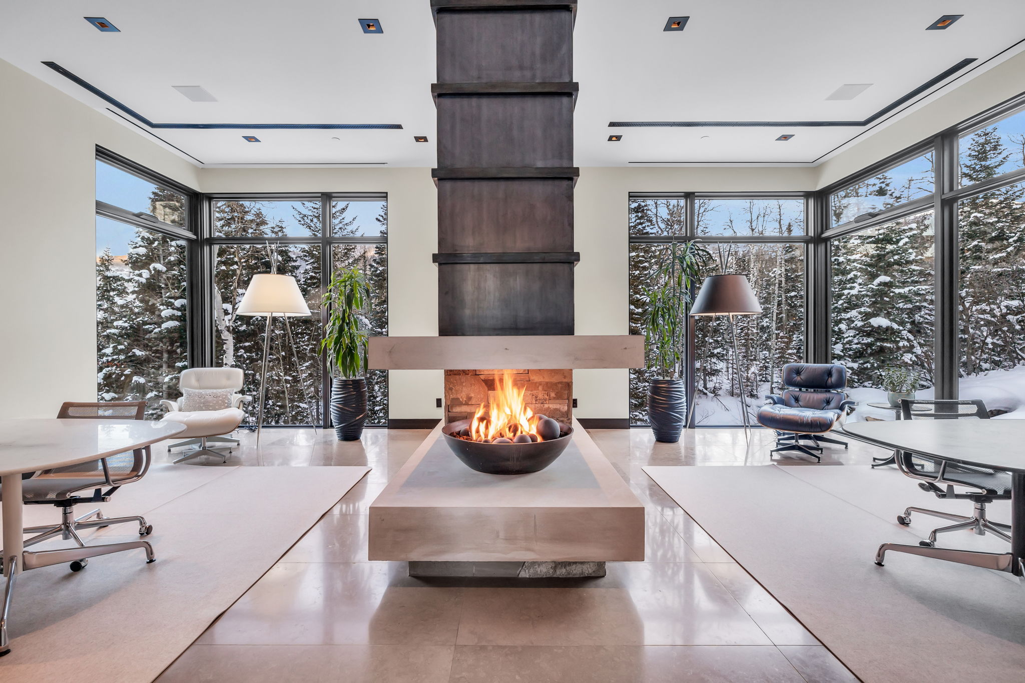 Central fireplace feature with an elevated hearth and integrated fire bowl