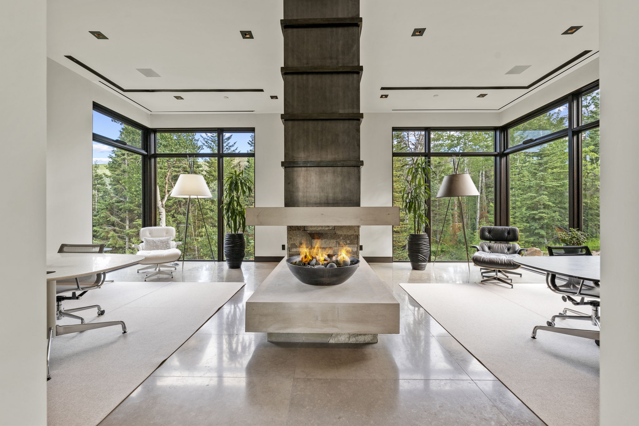 Central gas fire pit feature on a stone plinth