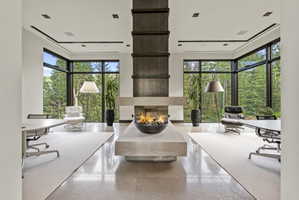 Central gas fire pit feature on a stone plinth