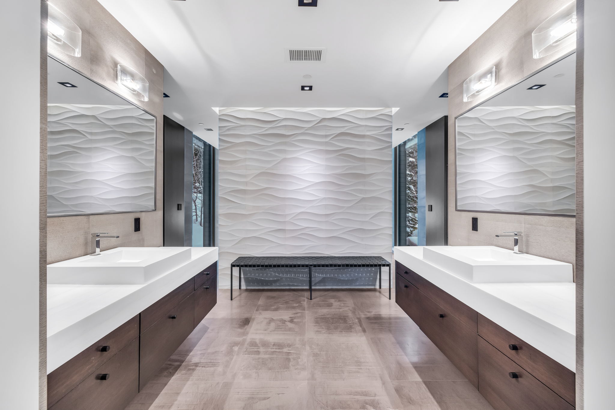 Dual floating vanities with integrated rectangular sinks and contemporary chrome faucets