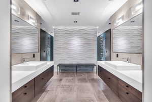 Dual floating vanities with integrated rectangular sinks and contemporary chrome faucets
