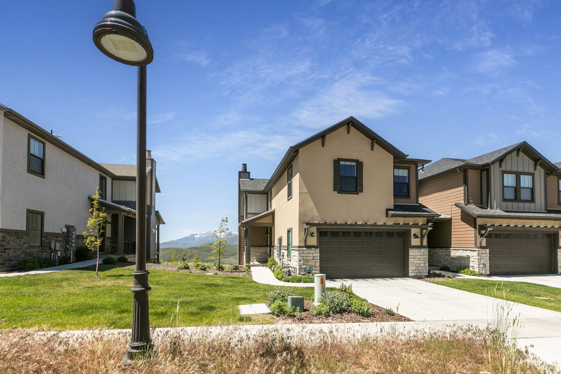 Contemporary home with stucco and stone veneer exterior