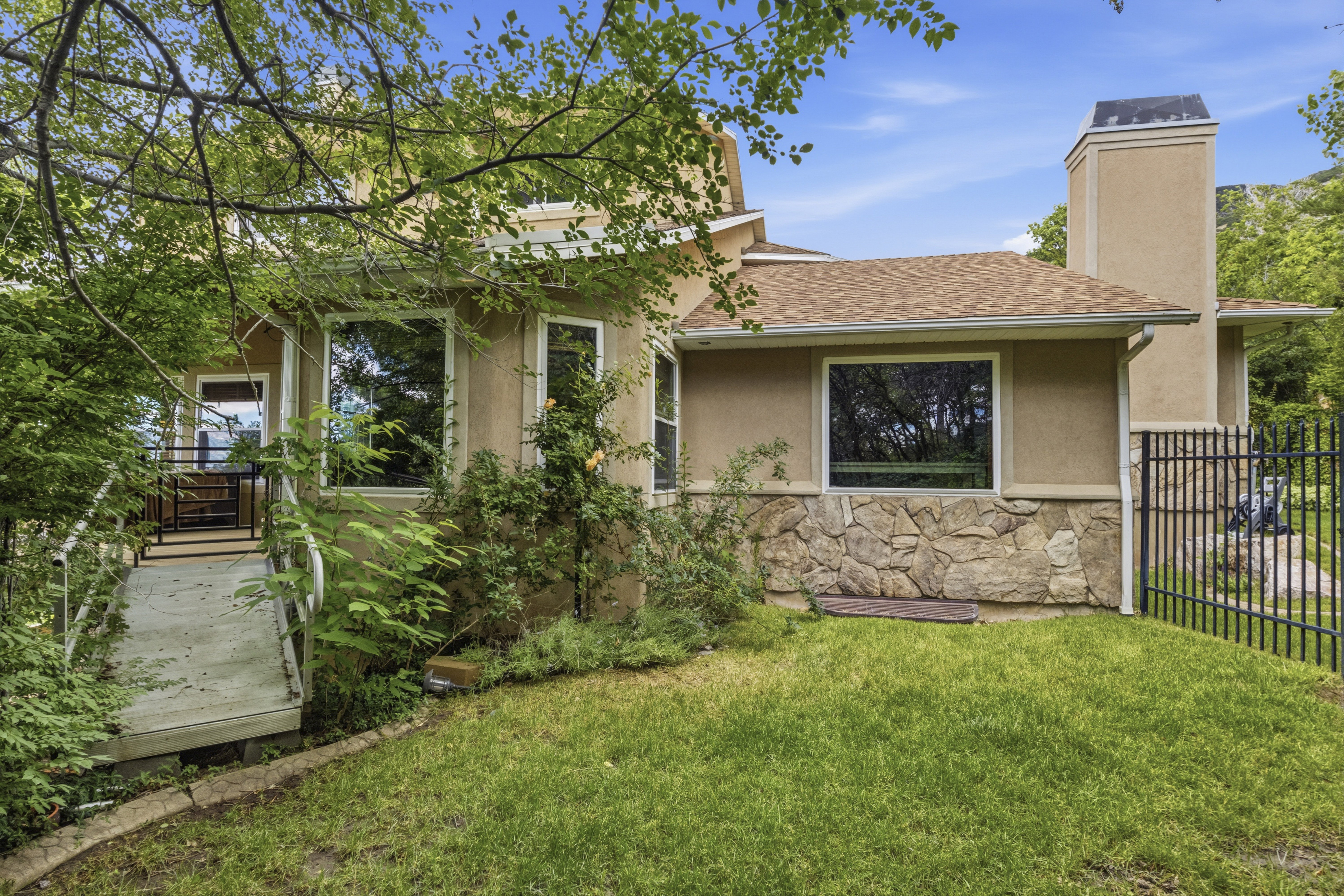Stucco exterior with stone accent detailing