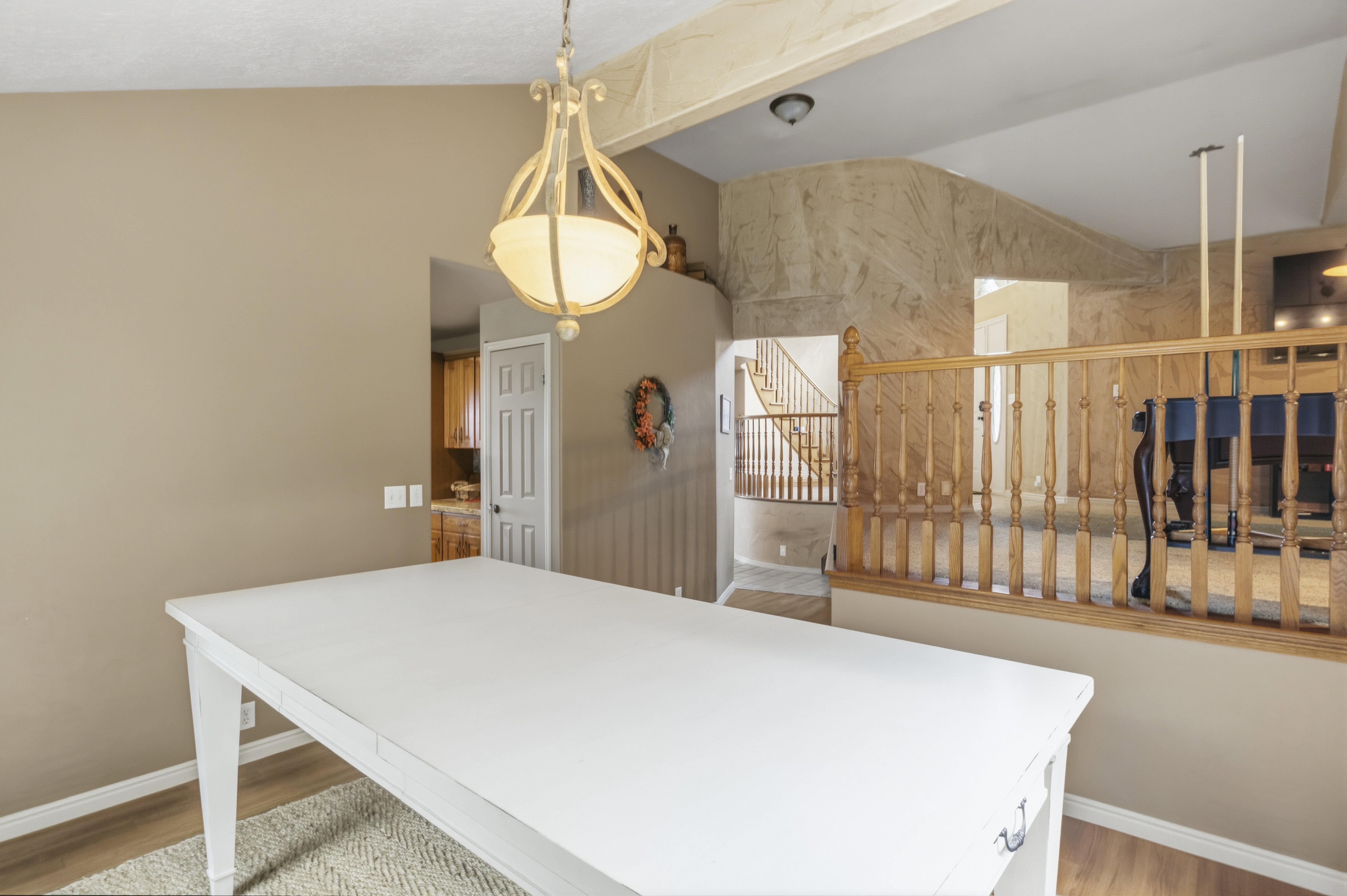 Dining area featuring a decorative chandelier and wood-finish flooring