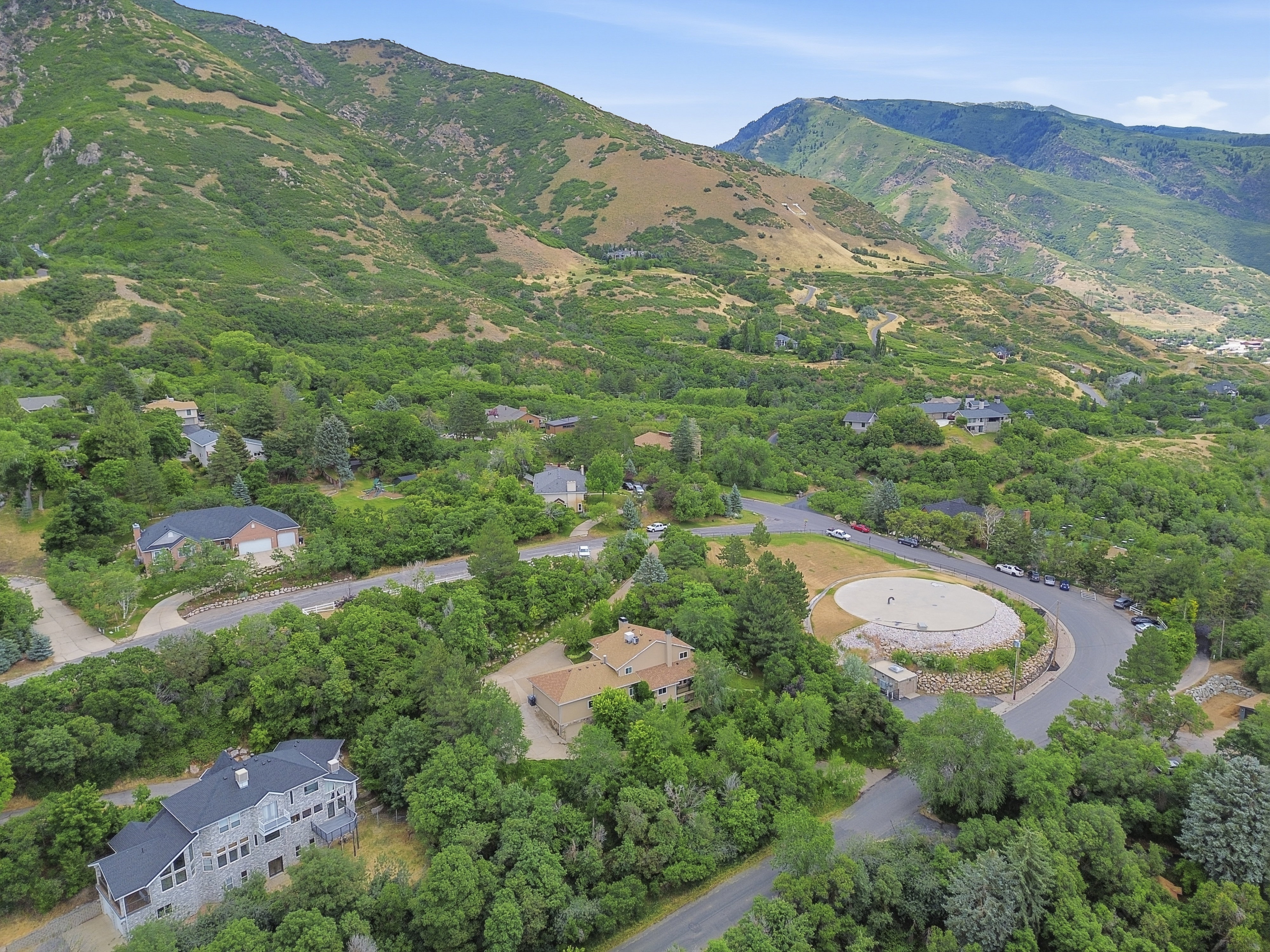 Lush, mountainous terrain surrounds this residential area