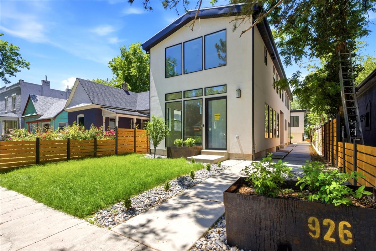Modern architectural design featuring expansive windows and a flat roofline