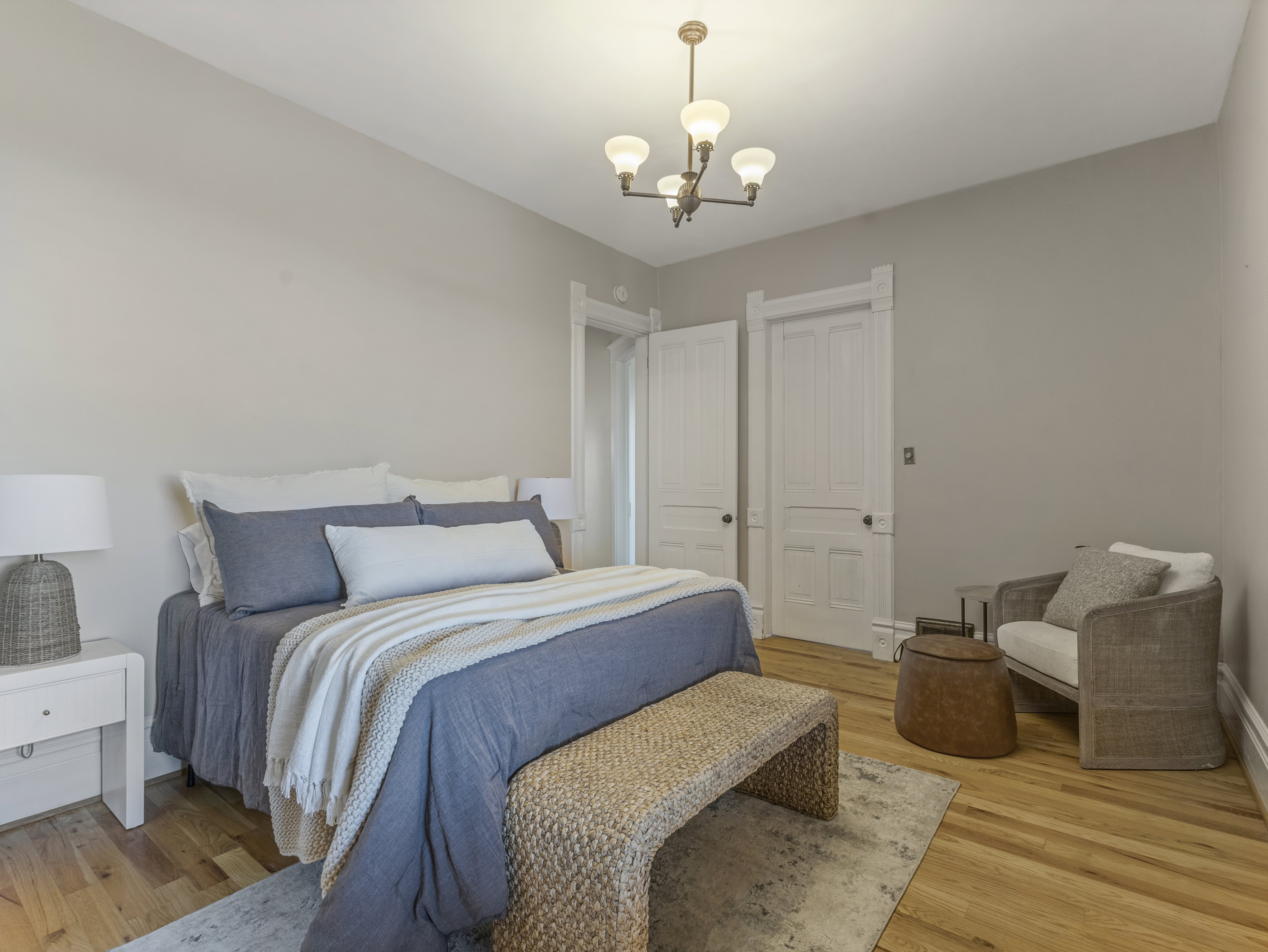 Light-toned walls with significant trim work and paneled doors