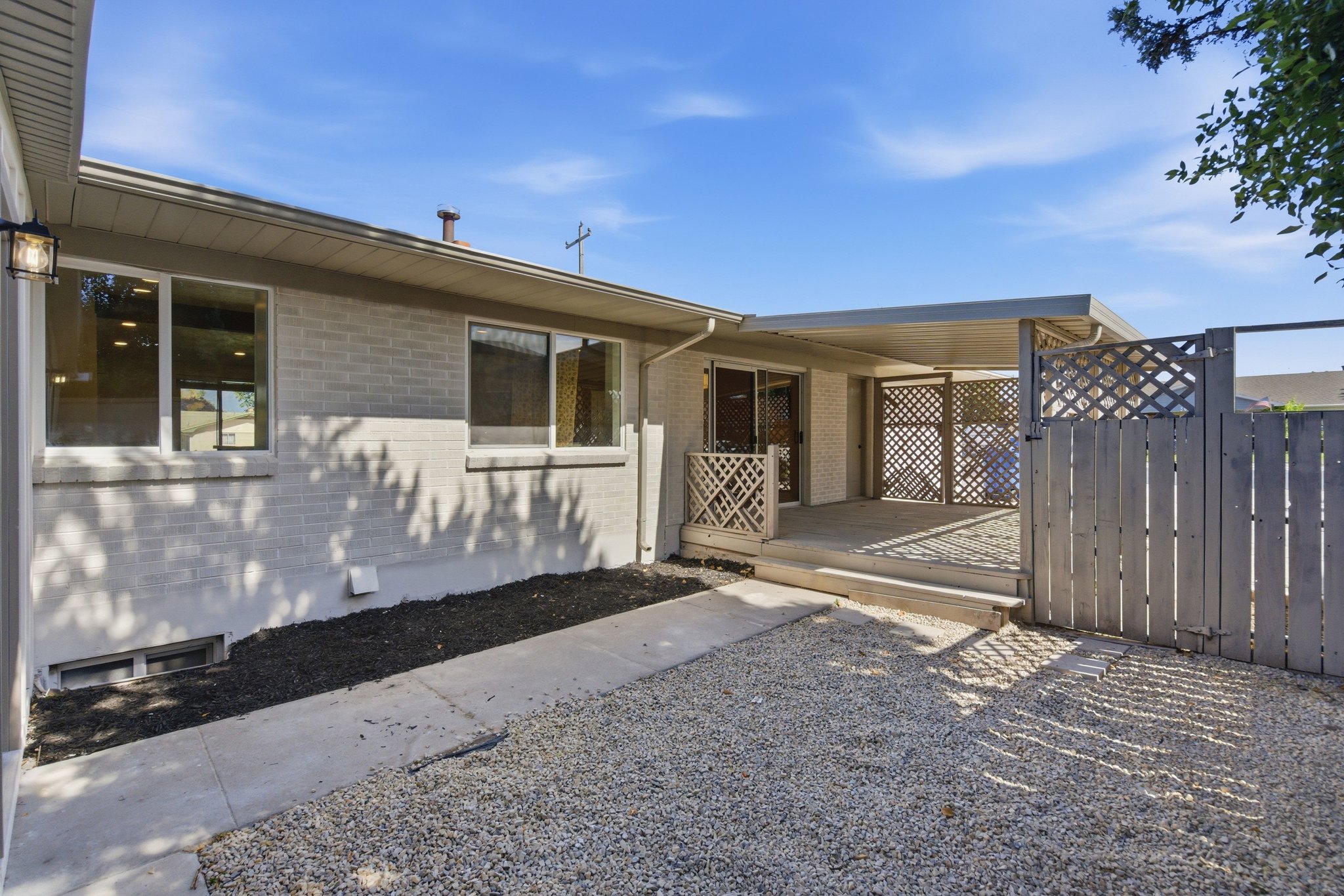 Exterior patio space featuring a concrete slab and a covered overhang