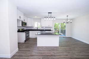 Open-concept living space with wood-finish flooring