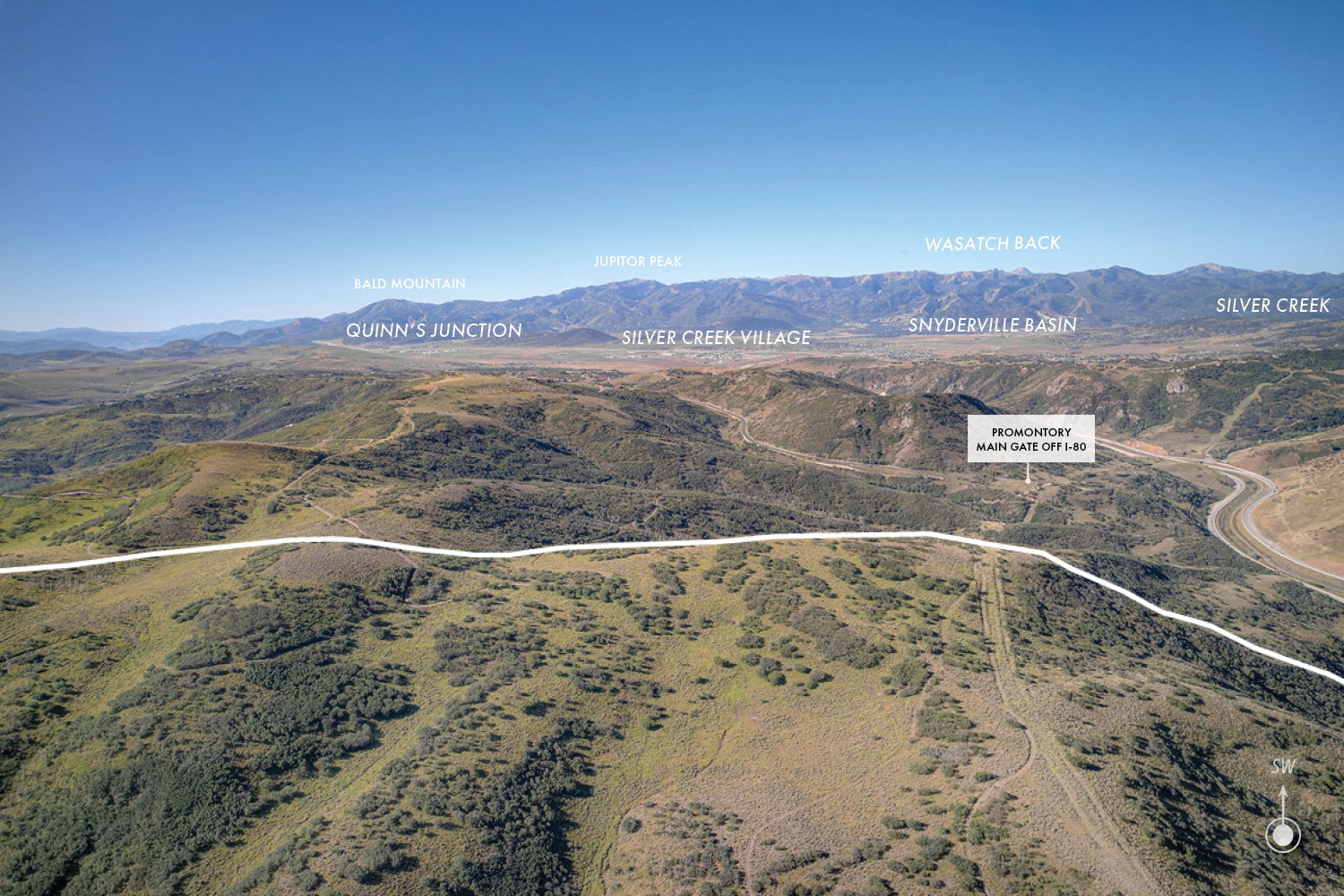 Expansive mountainous landscape featuring distant peaks including Bald Mountain, Jupiter Peak, and Wasatch Back
