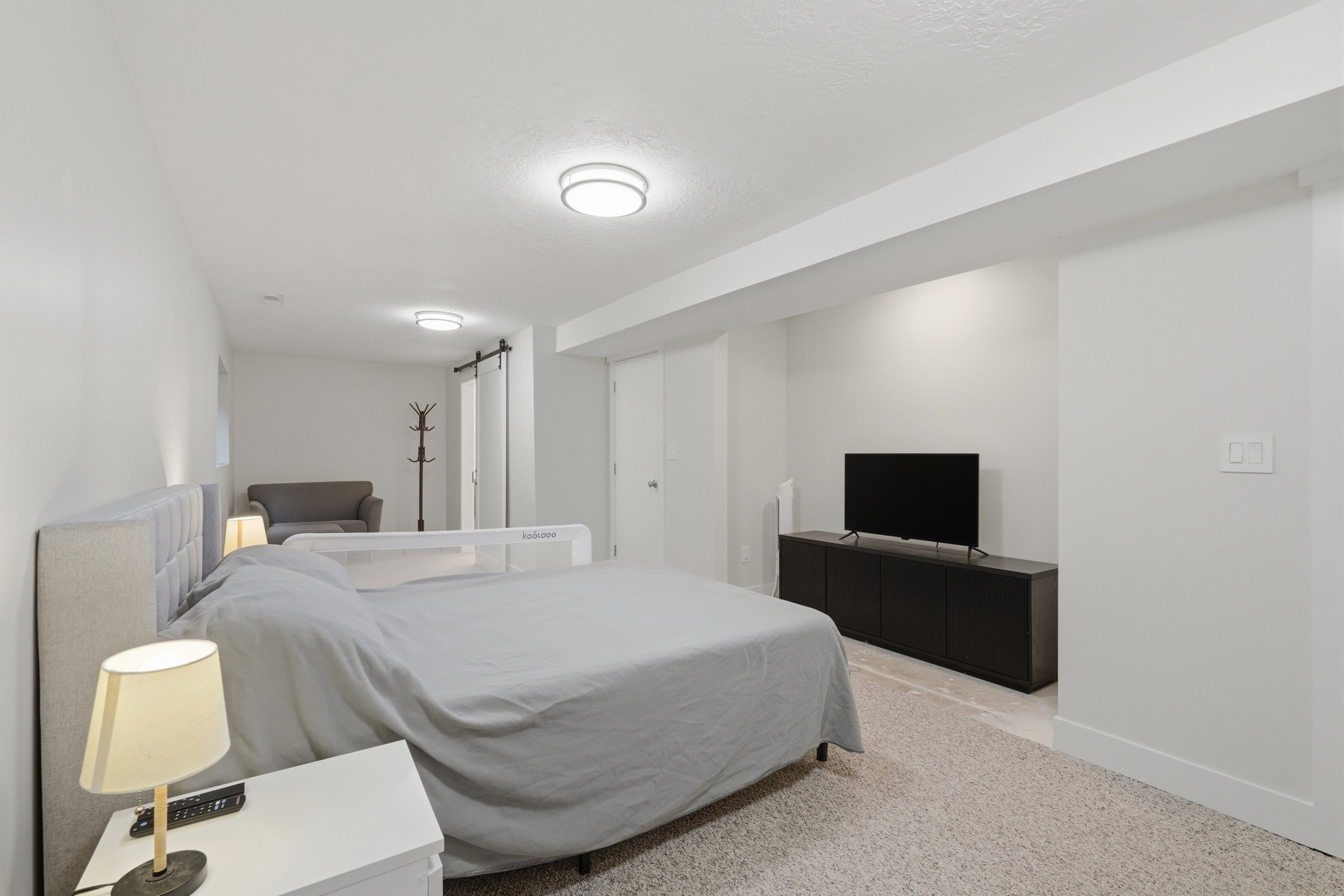 Carpeted room featuring recessed lighting and a white color palette
