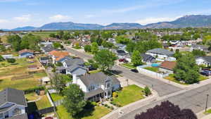 Residential neighborhood featuring a mix of single-family homes with pitched roofs and mature landscaping