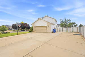 Expansive concrete driveway providing significant parking space with RV parking