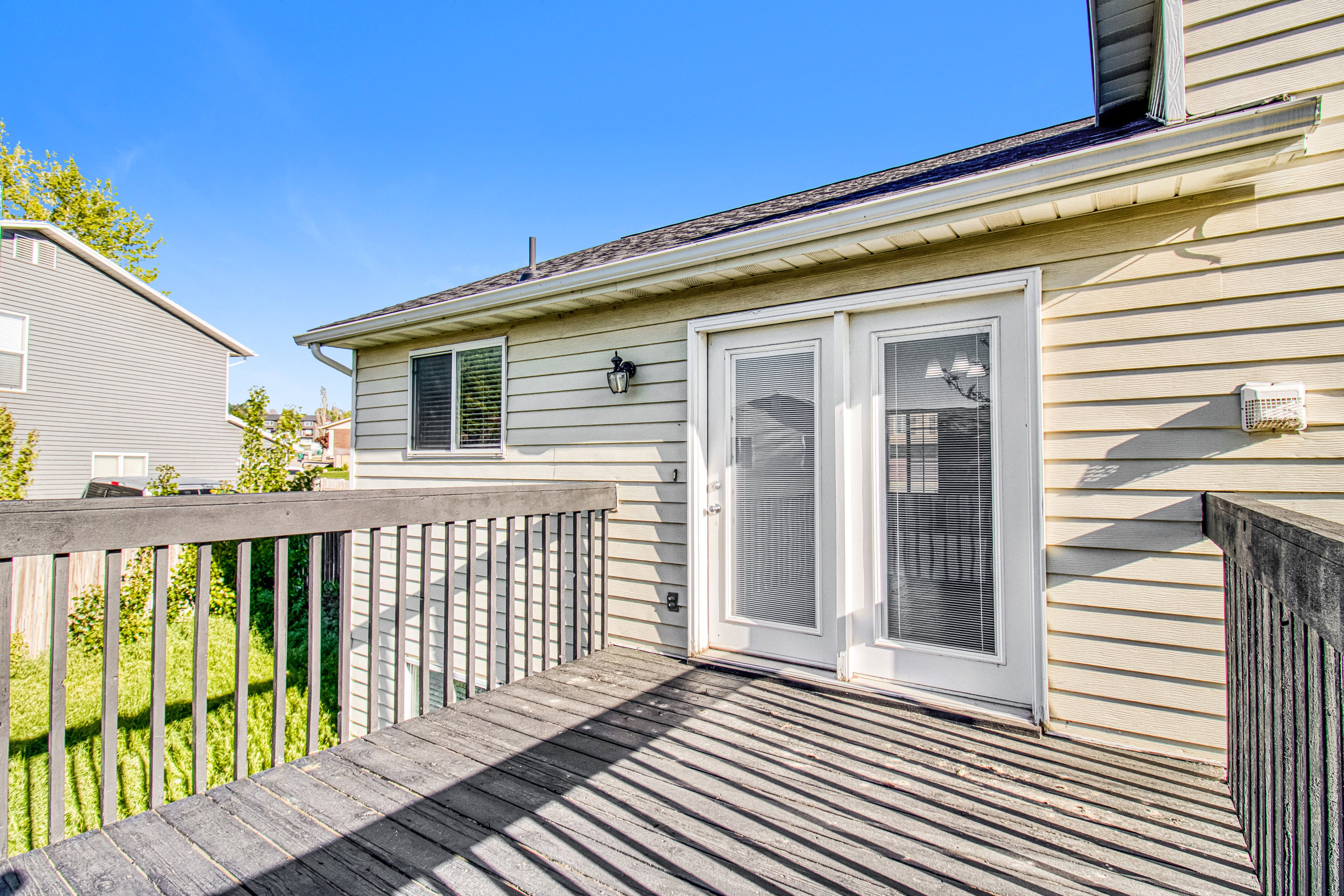 Exterior deck featuring wood flooring and railing