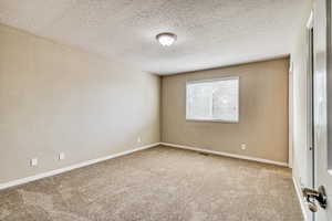 Neutral-toned walls complement the textured ceiling