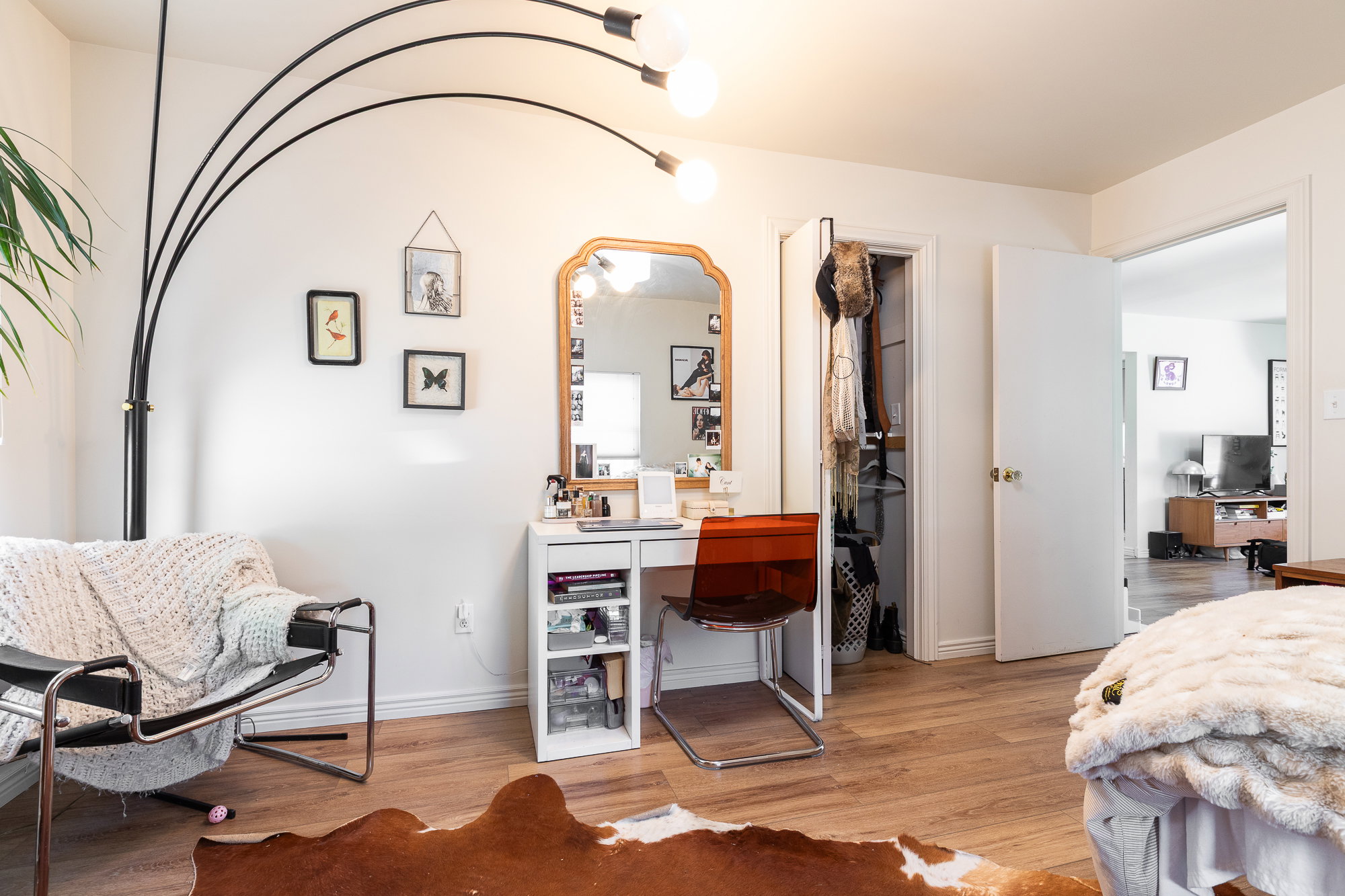 Interior space featuring wood-finish flooring, white baseboards, and neutral wall paint