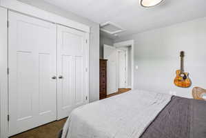 White paneled bi-fold closet doors with chrome hardware