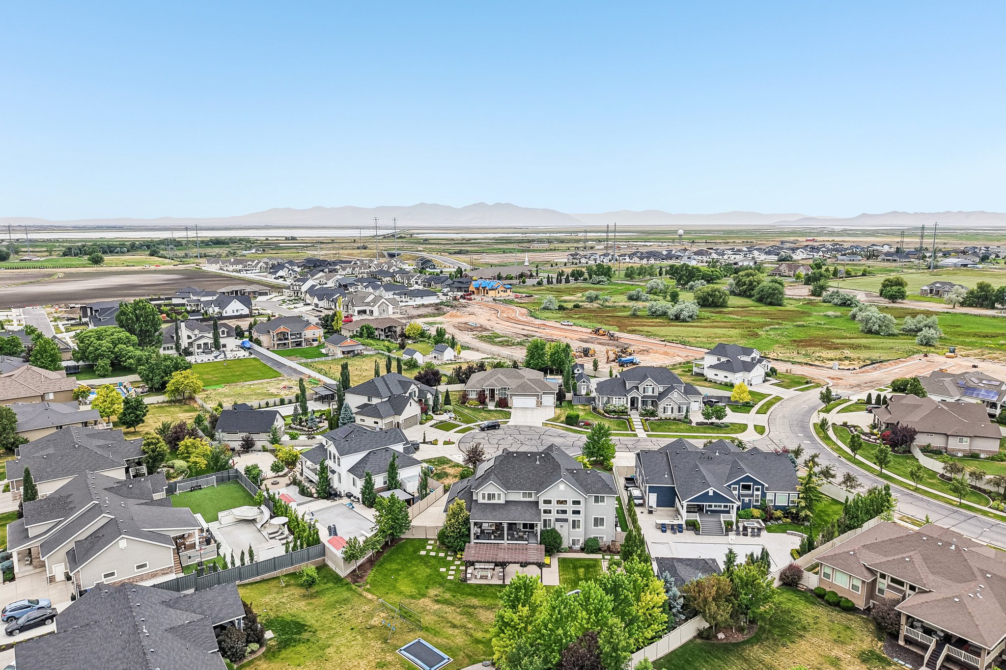 Expansive aerial perspective showcasing a residential development with varied architectural styles