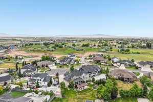 Aerial perspective showcasing a residential development with varied architectural styles and extensive green spaces