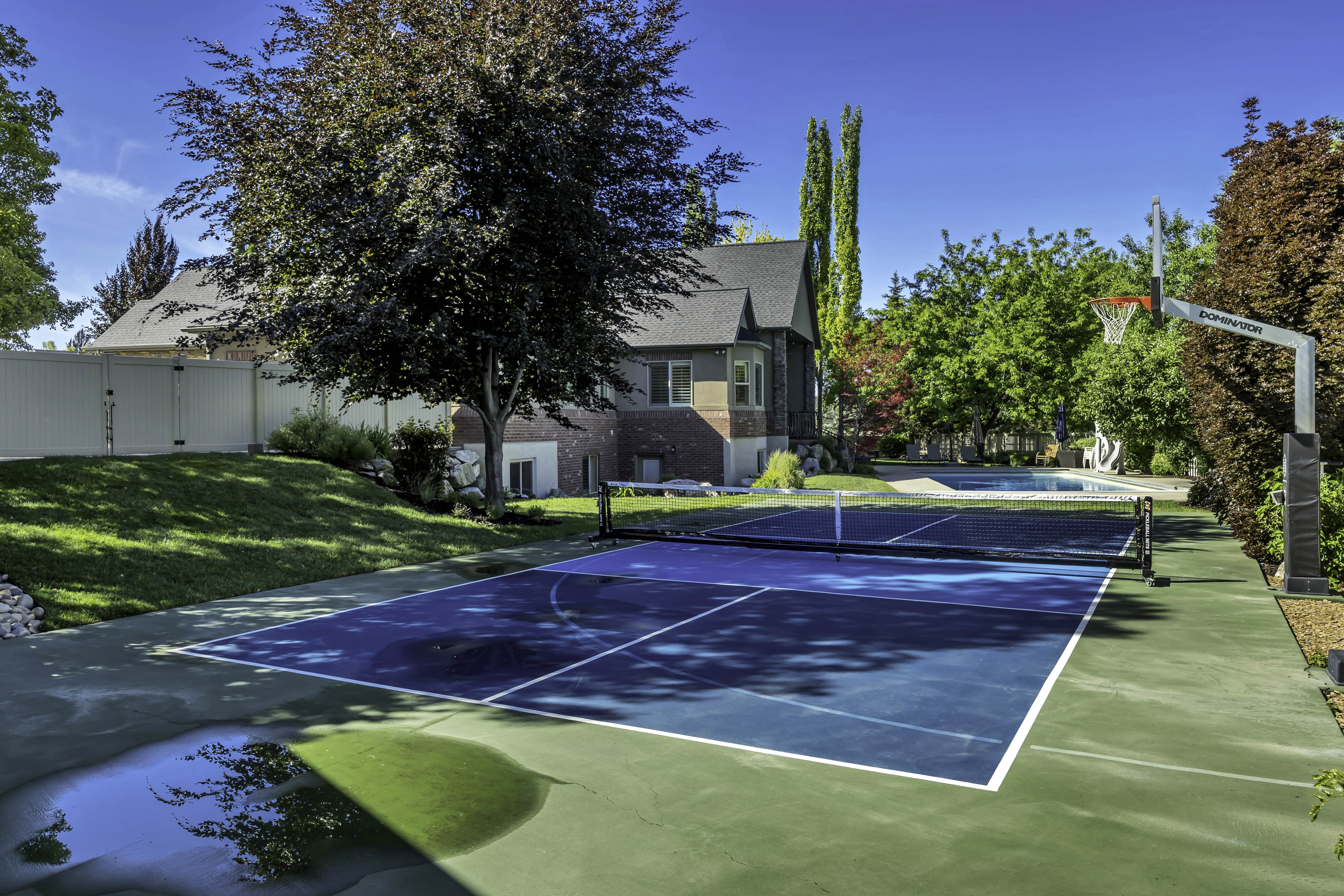 Multi-sport court featuring pickleball and basketball configurations