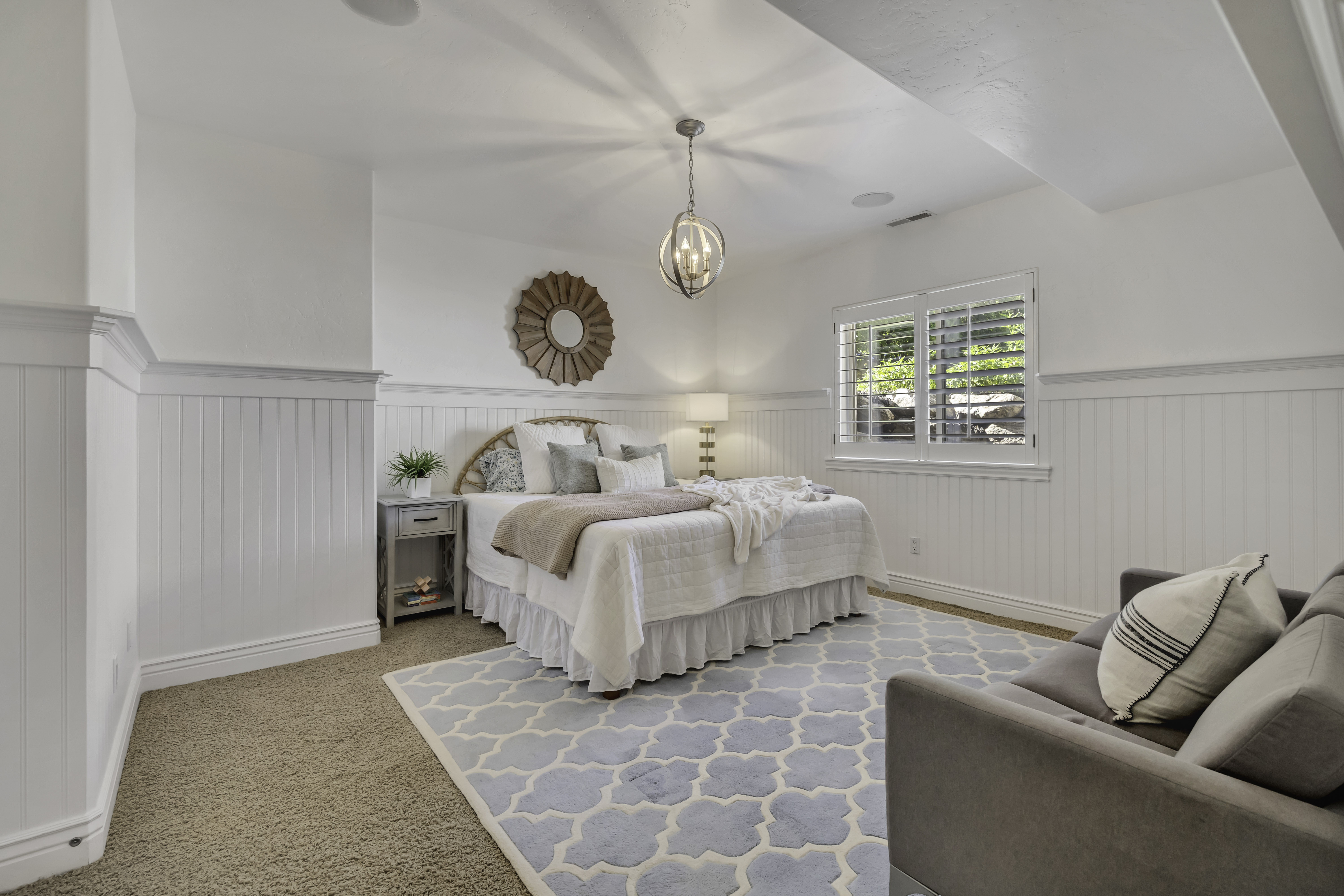 Room featuring white beadboard wainscoting and coordinating trim